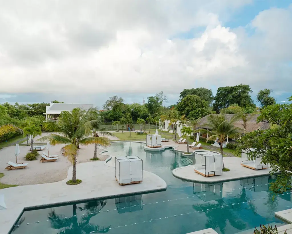 The lagoon pool, gardens and cabanas at Pronoia, Jimbaran