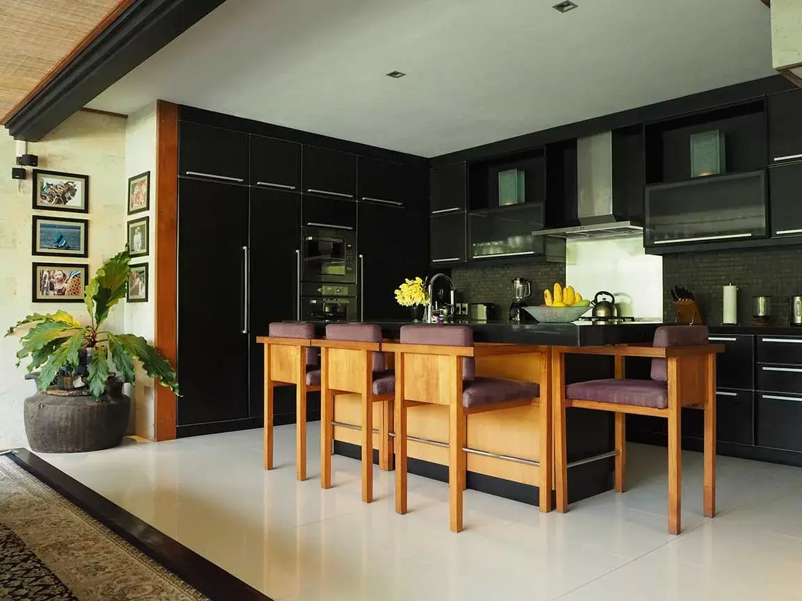 Villa kitchen with timber island and bar stools