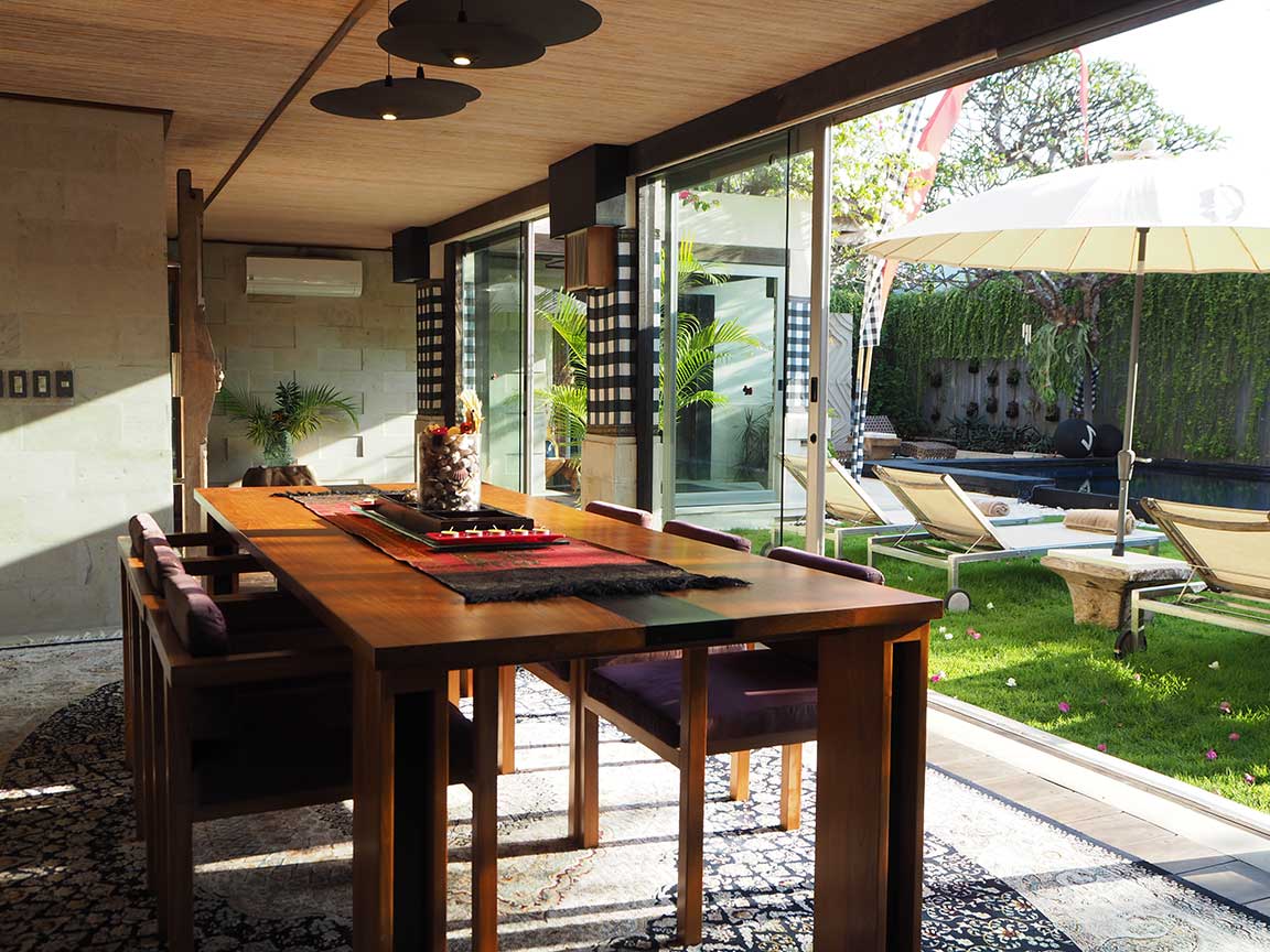 Dining area opening onto the pool garden