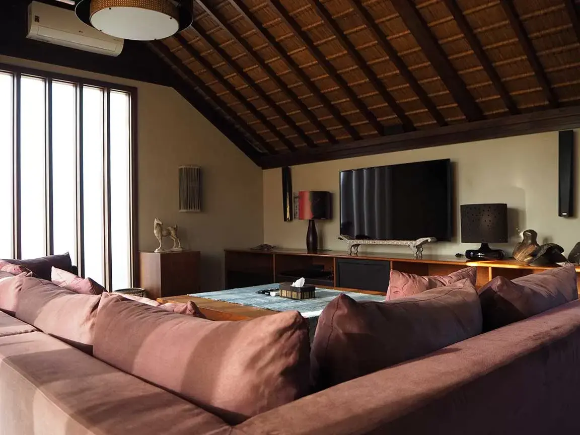 Living area beneath a vaulted timber ceiling