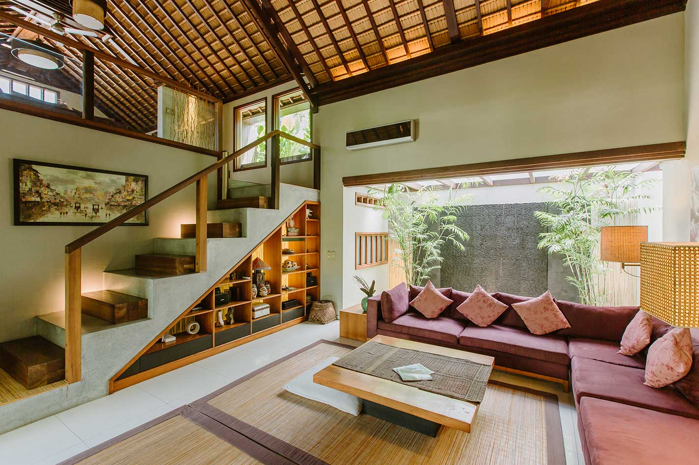 Open living room with staircase and garden view