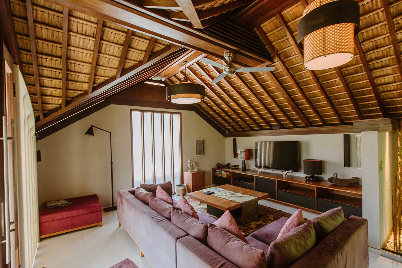 Living room with timber ceiling and garden doors